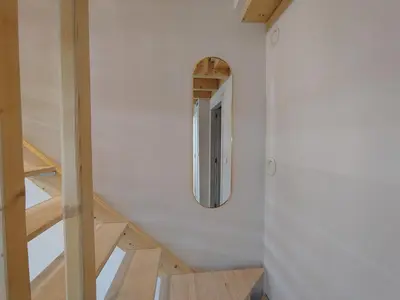 a hallway with a round mirror on a wall at Mandarina Suites - Unique apartments in Valencia in Valencia