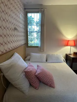 a bedroom with a bed with two pillows on it at El mirador de la Sonora in Artana