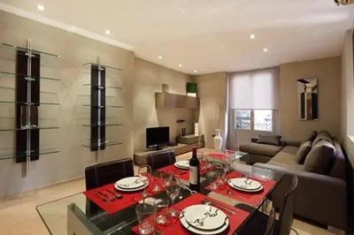 a living room with a table with wine glasses on it at Apartamento Plaza Reina in Valencia