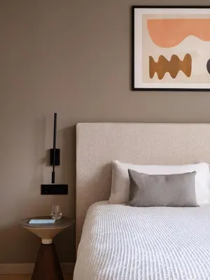 a bedroom with a bed and a picture on the wall at Numa Valencia El Carmen in Valencia