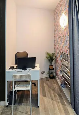 a desk with a laptop and a chair in a room at Estudio Loft área Ruzafa in Valencia
