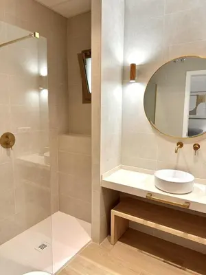 a bathroom with a sink and a mirror at Anelsa Suites Serranos 3 in Valencia