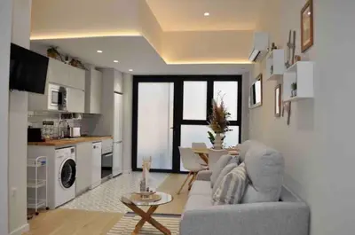 a living room with a couch and a table at Beautiful modern loft 1km from the sea in Valencia in Valencia