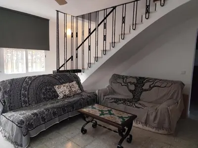 a living room with a couch and a coffee table at La Casa de los Alemanes in Gaibiel