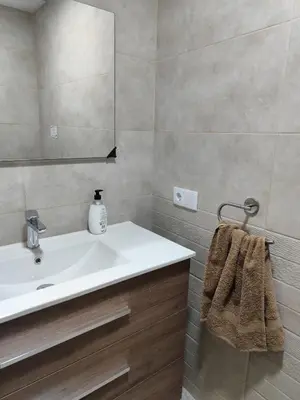 a bathroom with a sink and a mirror at La Casa de los Alemanes in Gaibiel