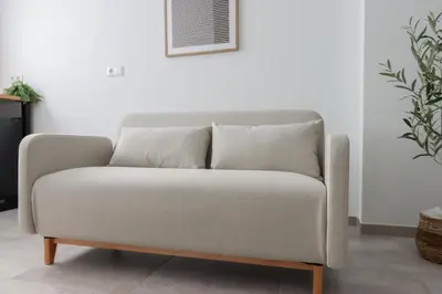 a white couch sitting in a living room at La plata 59 in Valencia