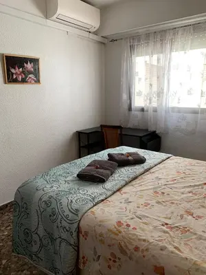 a bedroom with a bed with two pillows on it at Plaza Mare Nostrum 5 min playa in Puerto de Sagunto