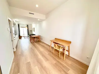 an empty room with a table and chairs in it at Filologo Sanelo Luxury Apartaments in Valencia