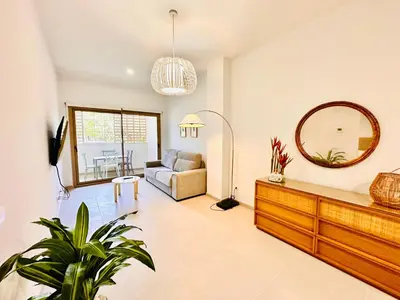 a living room with a couch and a mirror at Filologo Sanelo Luxury Apartaments in Valencia