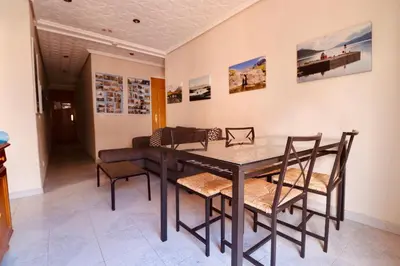 a dining room with a table and chairs at 2 Bed Apartment, Great Location, 500M from Beach in Valencia