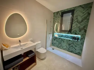 a bathroom with a sink and a shower and a toilet at Luxury apartment in Cabanyal in Valencia
