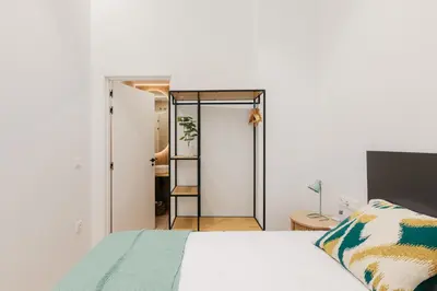 a bedroom with a bed and a mirror at Design loft in Valencia in Valencia
