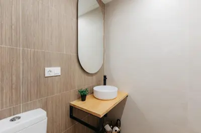a bathroom with a white sink and a mirror at Elegant Loft in Valencia in Valencia