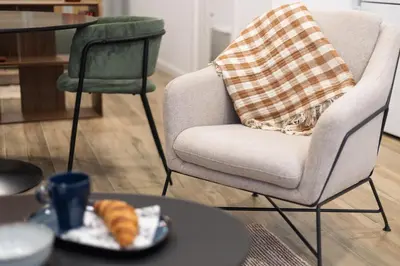 a living room with a chair and a plate of croissants at Moderno loft reformado, Smart TV, AC, Beach, 3Pax in Valencia