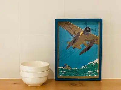a picture of a plane flying over the ocean at El Apartamento in Valencia
