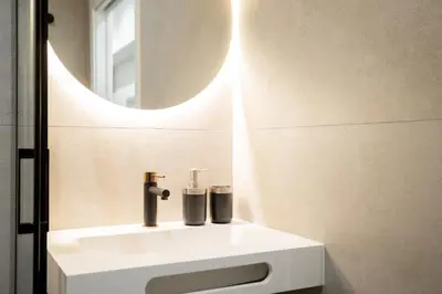 a bathroom with a white sink and a mirror at Valencia Central Flats - Exclusiva, junto al Roig Arena in Valencia