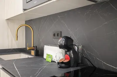 a kitchen counter with a toaster on a counter top at Valencia Central Flats-Elegante, junto al Roig Arena in Valencia