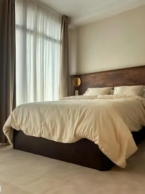 a bedroom with a large bed with a large window at Pivote Flats-Playa A in Valencia