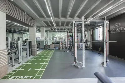 a gym with a lot of equipment in it at Fitness & Spa, Suite Atalanta Valencia in Valencia
