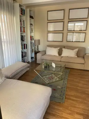 a living room with a couch and a coffee table at Apartamento Neptuno A4 in Puebla de Farnals