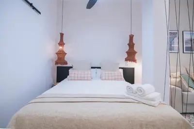 a bedroom with a bed with towels on it at District Key - Valencia, Fuencaliente D in Valencia