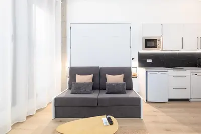 a living room with a couch and a table at Ca La Leni Beach 0 in Valencia