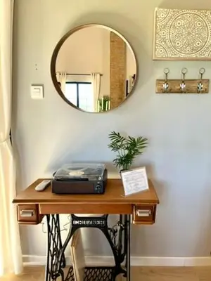 a dressing table with a mirror on a wall at Luminoso loft boutique a 5 min del metro in Bétera