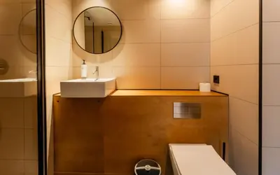 a room with two beds and a chair and a window at easyHotel Valencia Ciutat Vella in Valencia
