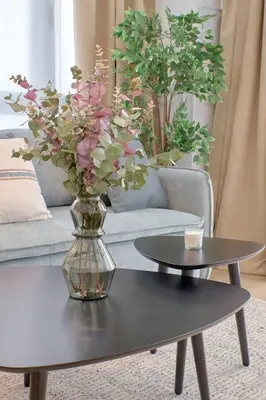 a vase of flowers on a table in a living room at Romantic Suite Roig Arena N1 Virkin Suites in Valencia