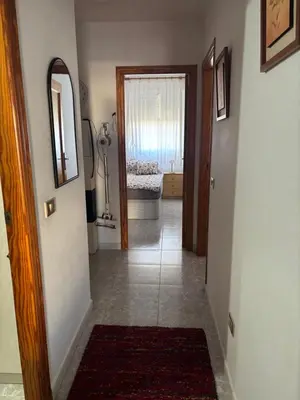 a hallway with a door leading to a room at Wohnung in Moncófar