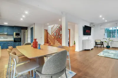 a kitchen and dining room with a table and chairs at Private Garden Villa near Valencia with Cinema and Gym in La Eliana