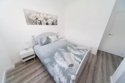 a bedroom with a bed and a painting on the wall at Luxury villa 20 minutes from Valencia in Lliria