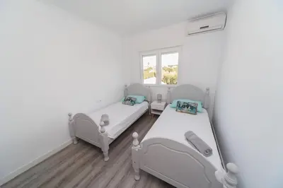 a bedroom with two beds and a window at Luxury villa 20 minutes from Valencia in Lliria