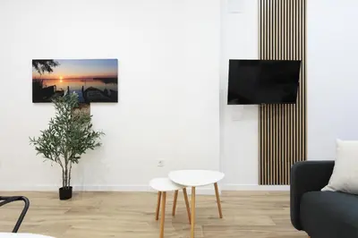 a living room with a couch and a table at Total Valencia Sorolla in Valencia