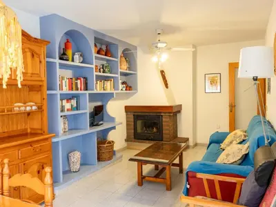 a living room with blue shelves and a fireplace at Apartamento Pinzón in Moncófar