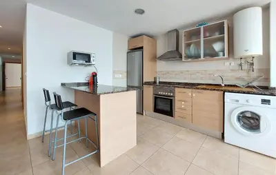 a kitchen with a washer and dryer in it at 2 Bedroom Awesome Apartment In Moncofa in Moncófar