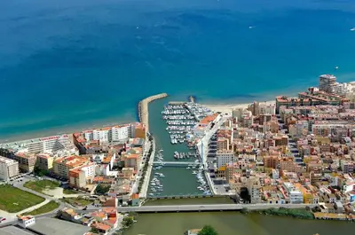 an aerial view of a city with a harbor at Fantastic beach apartment near Valencia in Valencia