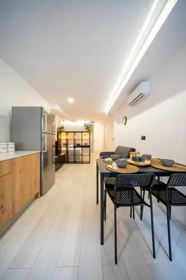 a kitchen and living room with a table and chairs at Accommodation for 4 people in Valencia