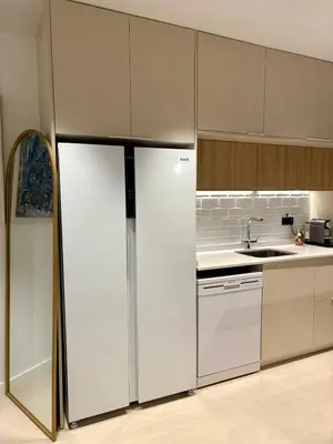 a kitchen with a refrigerator and a sink at Family Home Valencia in Aldaia