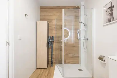a shower with a glass door in a bathroom at Flats Uruguay in Valencia