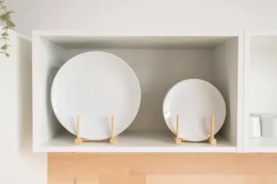 two round mirrors on a shelf in a room at Flats Uruguay in Valencia