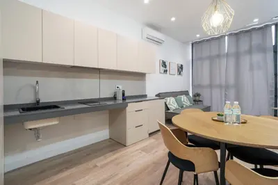 a kitchen and dining room with a table and chairs at VLC HOST - Oriente in Valencia