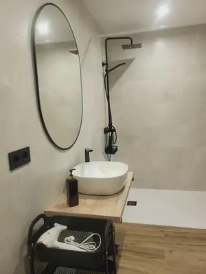 a bathroom with a white sink and a mirror at Charming Urban Stay in Valencia in Valencia