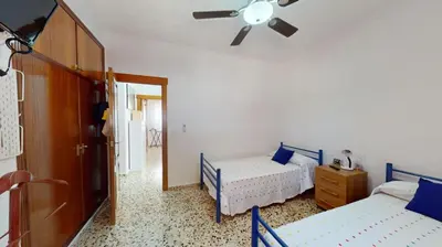 a bedroom with two beds and a ceiling fan at Exclusive Villa in Catadau: Pool & Private Gardens in Catadau