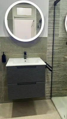 a bathroom with a sink and a mirror at Stylish and renovated house in Cullera
