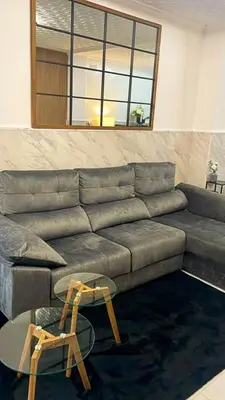 a living room with a couch and a table at Stylish and renovated house in Cullera