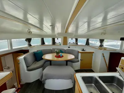 a small table and chairs in the middle of a boat at Barco para dormir sobre el Mar in Valencia