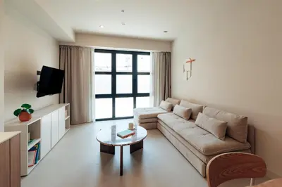 a living room with a couch and a table at The Atelier Lofts in Valencia