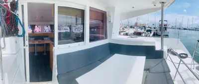 a balcony on a boat in the water at Catamaran Nora in Puebla de Farnals
