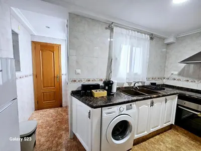 a kitchen with a sink and a stove at Apartamento playa Valencia in Mareny Barraquetas